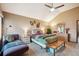 Bright main bedroom with vaulted ceiling, decorative wall art, and a comfortable seating area at 7954 S Franklin Ct, Centennial, CO 80122