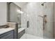 Modern shower featuring custom tile work, a built-in seat, and sleek bronze fixtures at 7954 S Franklin Ct, Centennial, CO 80122
