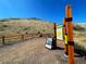 Tranquil open space featuring a path, educational signage, and natural views, offering a community amenity at 16541 W 48Th Ln, Golden, CO 80403