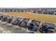 Aerial view of a neighborhood with houses near a park or green space at 16404 E 117Th Ave, Commerce City, CO 80022