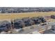 Aerial view of houses in neighborhood with many cars parked on the street at 16404 E 117Th Ave, Commerce City, CO 80022