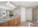 Bathroom with double vanity and walk-in shower at 16404 E 117Th Ave, Commerce City, CO 80022
