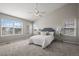 Spacious bedroom with large windows and a ceiling fan at 16404 E 117Th Ave, Commerce City, CO 80022