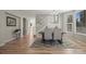 Bright dining room with hardwood floors, natural light, and staircase at 16404 E 117Th Ave, Commerce City, CO 80022