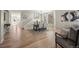 Open-concept dining room with hardwood floors and access to staircase at 16404 E 117Th Ave, Commerce City, CO 80022