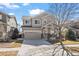 Beautiful two-story home with manicured lawn and spacious driveway at 16404 E 117Th Ave, Commerce City, CO 80022