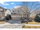 Charming two-story home with a well-manicured lawn and driveway at 16404 E 117Th Ave, Commerce City, CO 80022