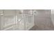 Upstairs loft with a white railing overlooking the staircase, offering versatile living space at 16404 E 117Th Ave, Commerce City, CO 80022