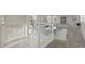 Upstairs loft with a white railing, billiard table, and versatile living space at 16404 E 117Th Ave, Commerce City, CO 80022