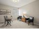 Home office with carpeted floors, a work desk, and two armchairs at 16404 E 117Th Ave, Commerce City, CO 80022