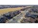 Street view of homes in a community with well-maintained lawns at 16404 E 117Th Ave, Commerce City, CO 80022