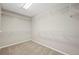 Spacious walk-in closet features ample shelving, neutral paint and carpet at 16404 E 117Th Ave, Commerce City, CO 80022