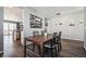 View of dining room with hardwood floors, neutral paint, and adjacent sliding glass doors to the backyard at 4128 Castle Vista Ln, Castle Rock, CO 80104