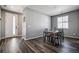 Dining room featuring hardwood floors, natural light, with a view of the front yard at 4128 Castle Vista Ln, Castle Rock, CO 80104