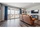 Bright living room featuring hardwood floors, recessed lighting, and a sliding glass door to outdoor space at 4128 Castle Vista Ln, Castle Rock, CO 80104