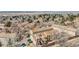 Aerial view of townhome community with city skyline in the distance at 14252 E Radcliff Cir, Aurora, CO 80015