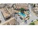 Aerial view of a community pool surrounded by townhomes and parking at 14252 E Radcliff Cir, Aurora, CO 80015
