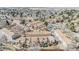 A neighborhood aerial view showing townhomes, mature landscaping, a community pool and parking at 14252 E Radcliff Cir, Aurora, CO 80015