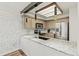 Renovated kitchen with granite countertops, stainless steel appliances, and a stylish black sink at 14252 E Radcliff Cir, Aurora, CO 80015