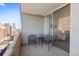 Balcony with metal chairs and views of the city at 909 N Logan St # 10C, Denver, CO 80203