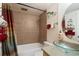 Bathroom with glass bowl sink, towels, tiled shower and colorful shower curtain at 909 N Logan St # 10C, Denver, CO 80203
