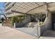 Building entrance with awning, steps, and greenery, offering a welcoming approach at 909 N Logan St # 10C, Denver, CO 80203