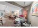 Well-lit common area with a dining table and a lounge space at 909 N Logan St # 10C, Denver, CO 80203