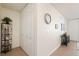 Hallway with closet doors, tile flooring, and decorative wall art at 909 N Logan St # 10C, Denver, CO 80203