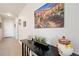 Entrance hall with decorative table, painting, and ceramic-lidded pot at 909 N Logan St # 10C, Denver, CO 80203