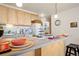This kitchen features light wood cabinets, modern appliances, and ample counter space at 909 N Logan St # 10C, Denver, CO 80203