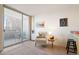 Comfortable living room features a large sliding glass door leading to an outdoor balcony area at 909 N Logan St # 10C, Denver, CO 80203