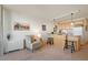 Open-concept living area with a large island and breakfast bar leading into the kitchen at 909 N Logan St # 10C, Denver, CO 80203