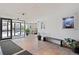 Building lobby featuring tiled floor, glass doors, seating and decor at 909 N Logan St # 10C, Denver, CO 80203