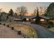 Aerial view of the property displaying the well-maintained lawn and winding driveway at 7382 W Stanford Ave, Littleton, CO 80123