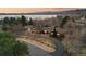 Aerial view of the home near a lake, surrounded by a well-manicured landscape at 7382 W Stanford Ave, Littleton, CO 80123