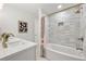 Beautiful bathroom featuring modern fixtures, a white vanity with dual sinks, and a shower over a tub at 7382 W Stanford Ave, Littleton, CO 80123
