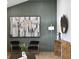 Stylish entryway with modern artwork, sleek wood floors, and decorative wall paneling at 7382 W Stanford Ave, Littleton, CO 80123