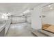 Spacious two car garage with additional storage and a separate work area, perfect for a workshop or hobbies at 7382 W Stanford Ave, Littleton, CO 80123