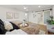 Bright bedroom featuring a sliding barn door that leads into the bathroom, creating a luxurious and spa-like retreat at 7382 W Stanford Ave, Littleton, CO 80123