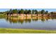 Vista Ridge community entrance with lake reflection at 1546 Hickory Dr, Erie, CO 80516