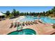 Community pool with a water slide, spa, and lounge area at 1546 Hickory Dr, Erie, CO 80516