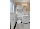Fresh bathroom includes a toilet, sink, and cabinet at 1658 Winona Ct, Denver, CO 80204