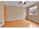 Bright bedroom with hardwood floors, neutral walls, and a ceiling fan at 1658 Winona Ct, Denver, CO 80204