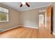 Cozy bedroom with hardwood floors, window with blinds, and neutral paint at 1658 Winona Ct, Denver, CO 80204