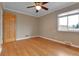 Bedroom featuring hardwood floors, a ceiling fan and a window at 1658 Winona Ct, Denver, CO 80204
