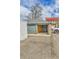 Detached garage with open back, accessible driveway, and ample parking space at 1658 Winona Ct, Denver, CO 80204