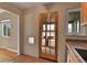 View of the kitchen featuring warm tones, a door to the outside, and a small pet door at 1658 Winona Ct, Denver, CO 80204