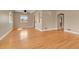 Bright living room with hardwood floors, neutral paint, and ceiling fan at 1658 Winona Ct, Denver, CO 80204