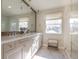 Modern bathroom featuring a double vanity, window, and glass shower at 2320 N Lafayette St, Denver, CO 80205