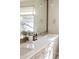 Bright bathroom with a white quartz countertop, pendant lights, and large mirror at 2320 N Lafayette St, Denver, CO 80205